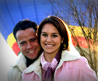A couple enjoying a romantic hot air ballooning experience
